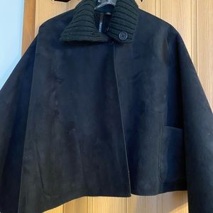 A “XL” black cape.